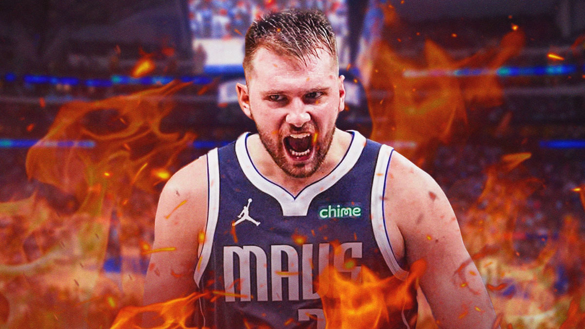 Mavericks' Luka Doncic yelling with flames all around him