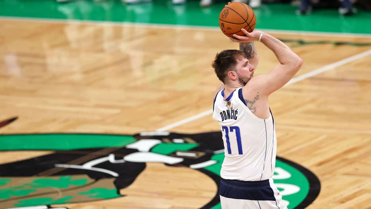 Dallas Mavericks guard Luka Doncic (77) shoots the ball against the Boston Celtics during the third quarter of Game 5 of the 2024 NBA Finals at TD Garden.