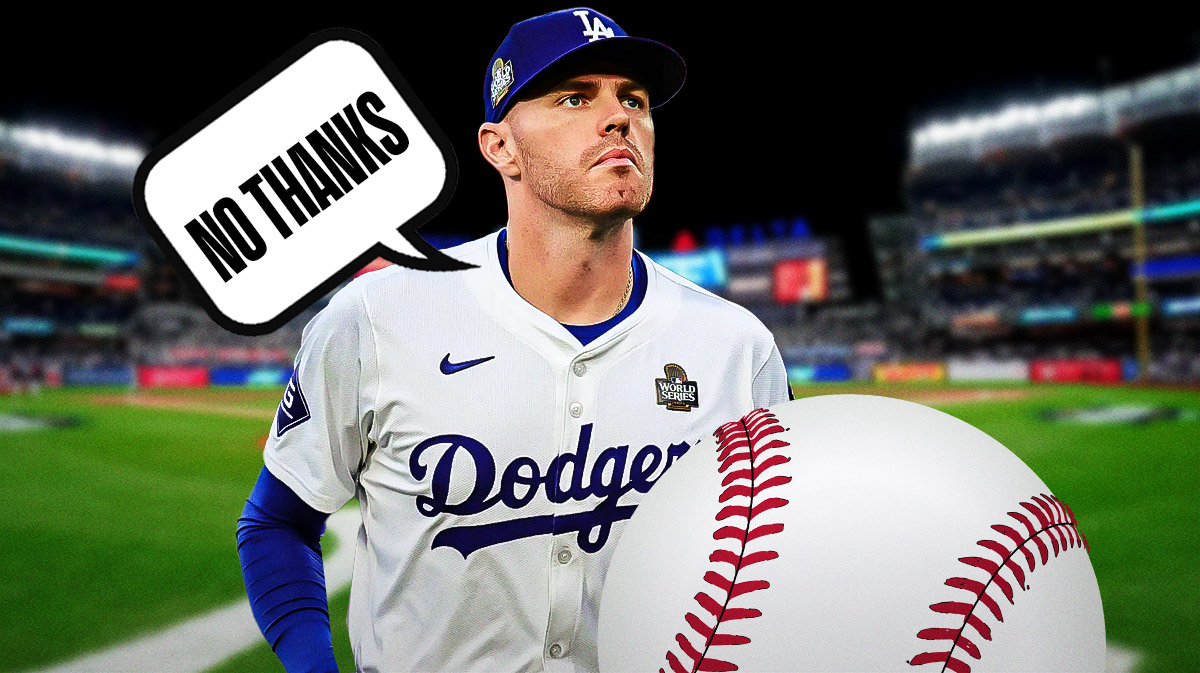 Photo: Freddie Freeman in action in Dodgers jersey saying "No thanks" with Yankee Stadium as background