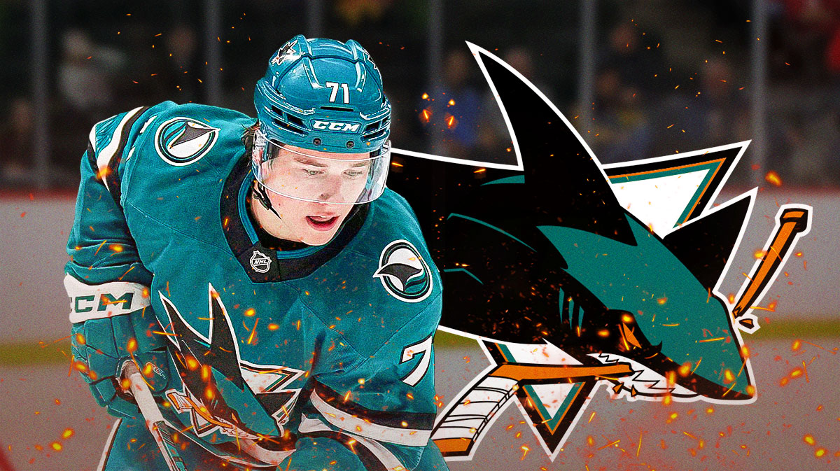 Macklin Celebrini in image with fire around him looking happy, San Jose Sharks logo, hockey rink in background