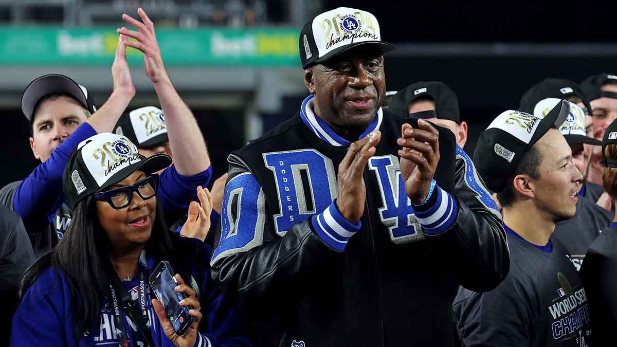 Los Angeles Dodgers owner Magic Johnson celebrates after the Los Angeles Dodgers beat the New York Yankees in game four to win the 2024 MLB World Series at Yankee Stadium.