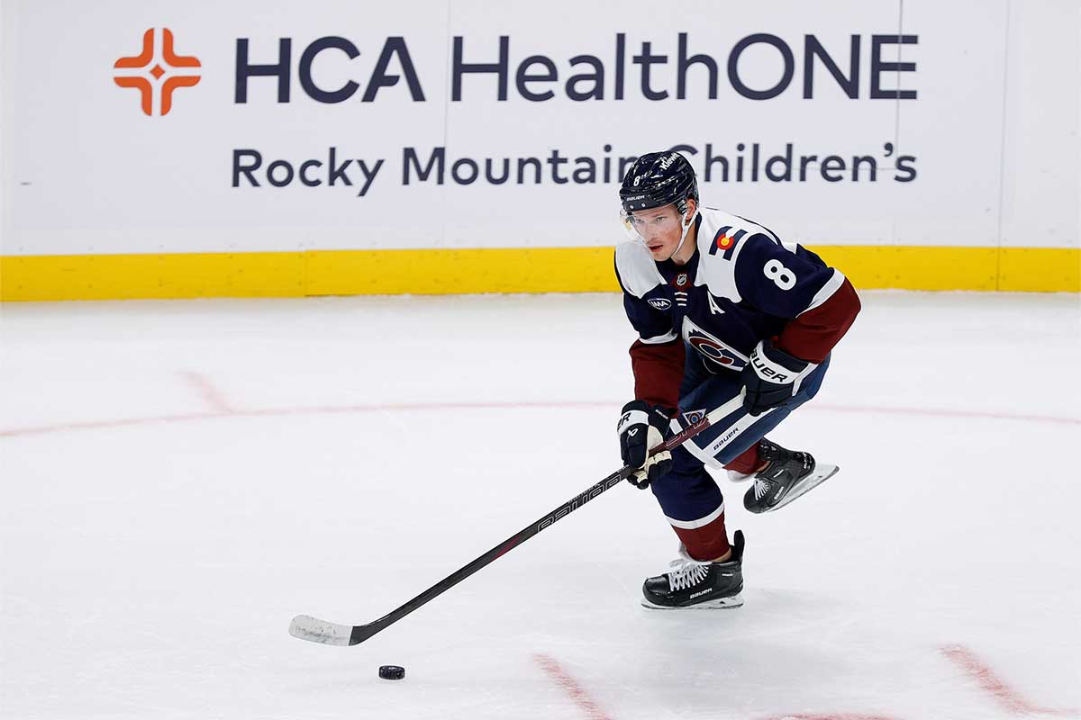 Colorado Avalanche defenseman Cale Makar (8) controls the puck in the first period against the Chicago Blackhawks at Ball Arena.
