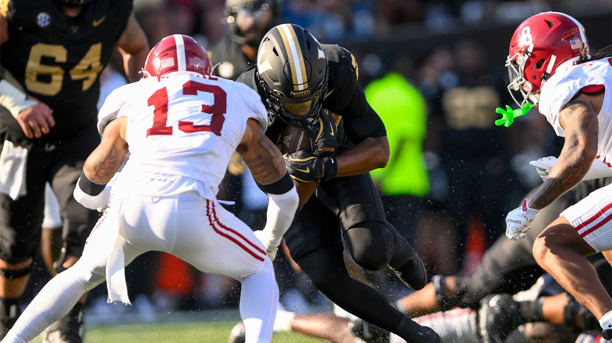 Alabama Crimson Tide defensive back Malachi Moore (13) tackles Vanderbilt Commodores running back AJ Newberry (23) during the first half at FirstBank Stadium.