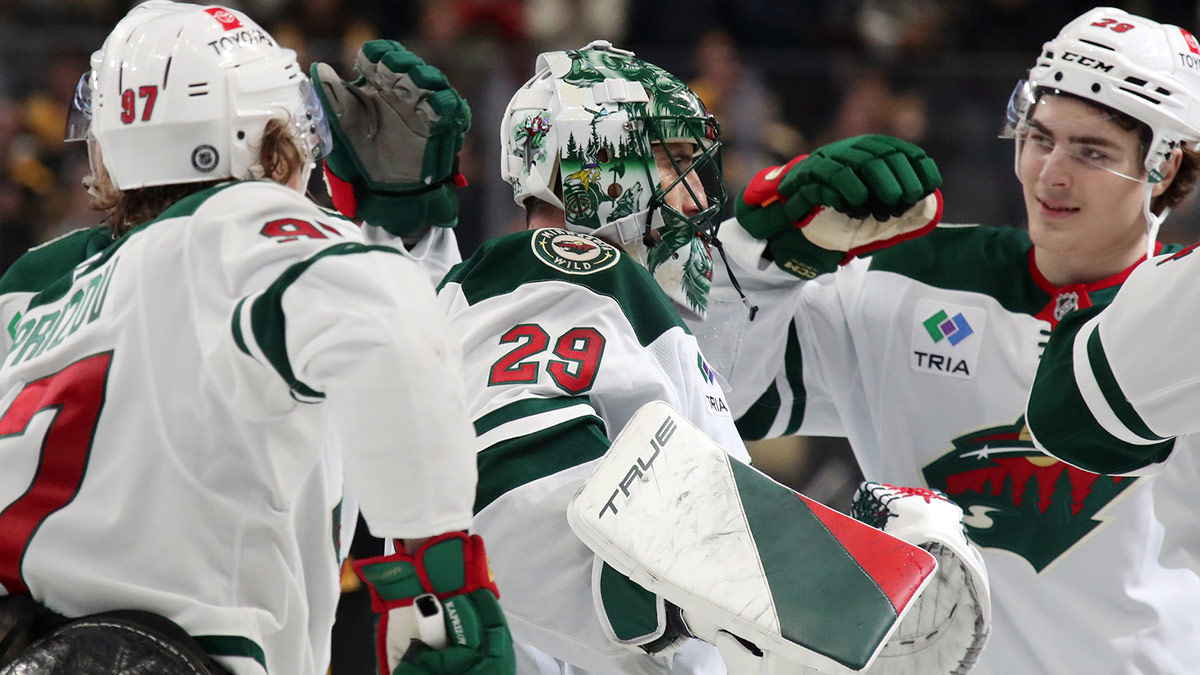 Minnesota Wild goaltender Marc-Andre Fleury (29) is congratulated by teammates after taking a victory lap in honor of his last game in Pittsburgh and defeating the Pittsburgh Penguins at PPG Paints Arena. Fleury began his career with the Penguins earning three Stanley Cups in Pittsburgh.