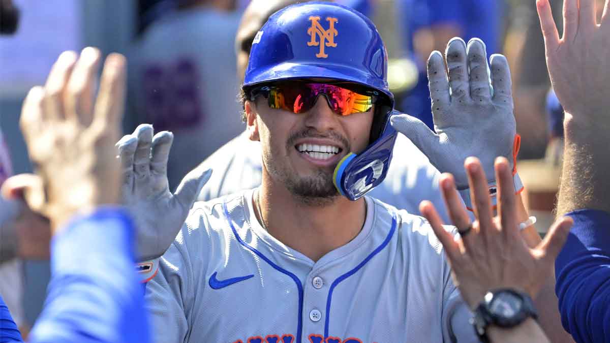 New York Mets outfielder Tyrone Taylor (15) celebrates after scoring on a grand slam home run by third baseman Mark Vientos (not pictured) in the second inning against the Los Angeles Dodgers during game two of the NLCS for the 2024 MLB Playoffs at Dodger Stadium.