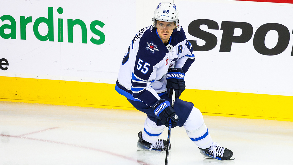 Winnipeg Jets center Mark Scheifele (55) controls the puck during warm-ups against the Calgary Flames at Scotiabank Saddledome.