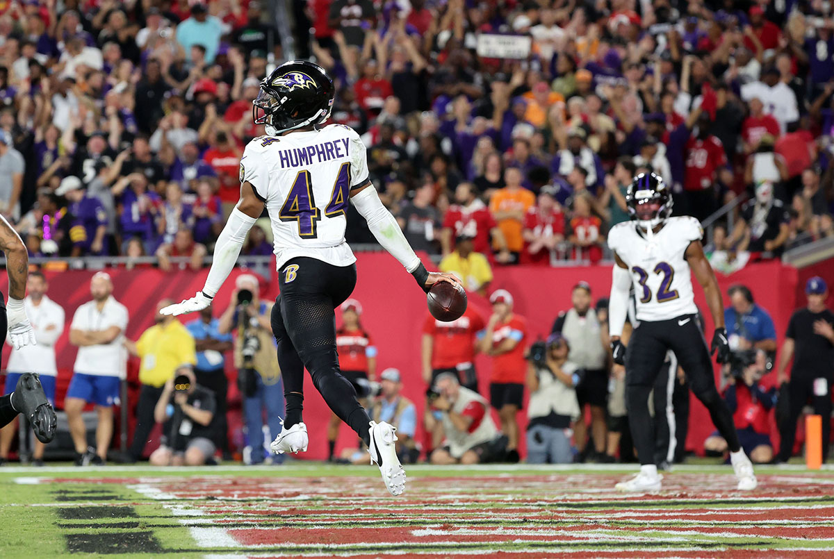 Baltimore Ravens cornerback Marlon Humphrey (44) celebrates after he intercepted the ball in the end zone against the Tampa Bay Buccaneers during the first half at Raymond James Stadium.
