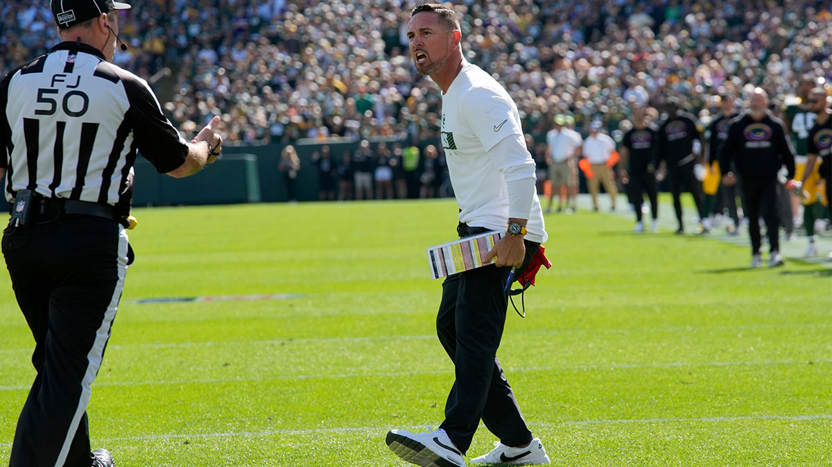 Green Bay Packers head coach Matt LaFleur argues a call on a muffed punt with field judge Aaron Santi (50) during the second quarter of their game against the Minnesota Vikings Sunday, September 29, 2024 at Lambeau Field in Green Bay, Wisconsin.