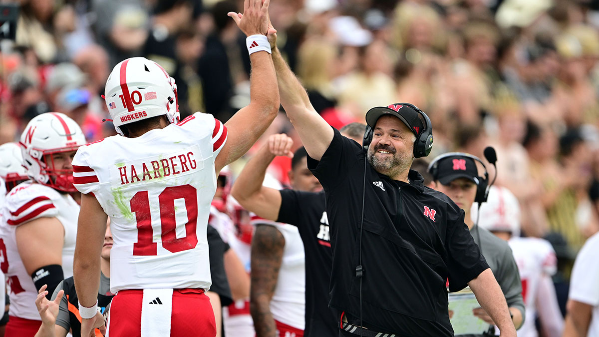Nebraska Cornhuskers head coach Matt Rhule high fives quarterback Heinrich Haarberg (10) during the first quarter against the Purdue Boilermakers at Ross-Ade Stadium.