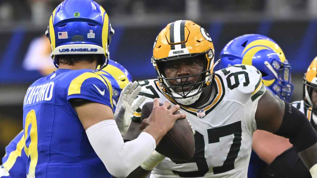 Green Bay Packers defensive tackles Kenny Clark (97) pressures Los Angeles Rams quarterback Matthew Stafford (9) during the fourth quarter at SoFi Stadium. 