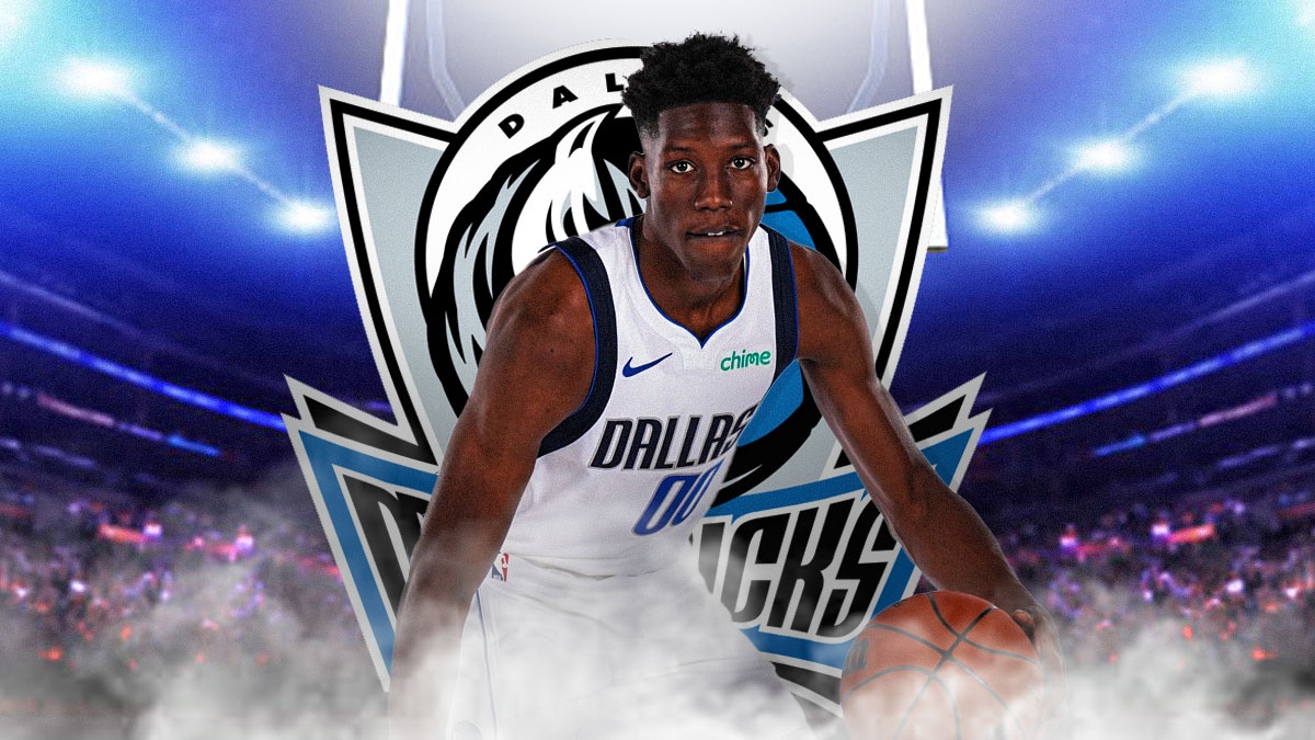 Jazian Gortman wearing Mavs gear. Mavericks logo in the background.