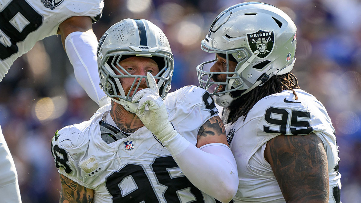 Las Vegas Raiders defensive end Maxx Crosby (98) celebrates with defensive tackle John Jenkins (95) after sacking Baltimore Ravens quarterback Lamar Jackson (not pictured) during the second half at M&T Bank Stadium.