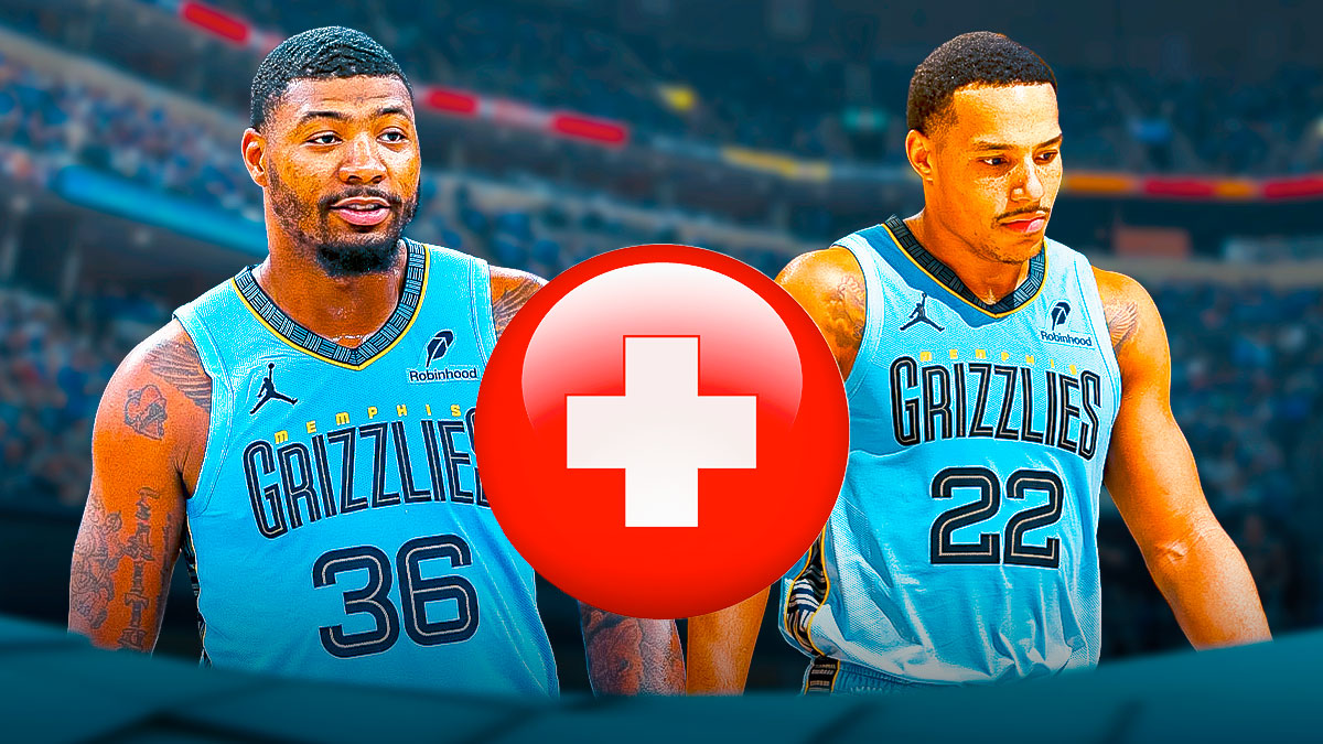 Grizzlies' Desmond Bane and Marcus Smart with medical Red Cross symbol between them