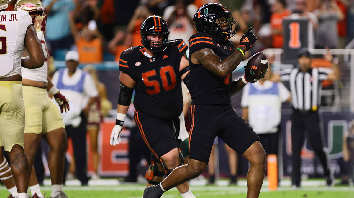 Miami Hurricanes running back Mark Fletcher Jr. (4) reacts after scoring a touchdown against the Florida State Seminoles during the first quarter at Hard Rock Stadium