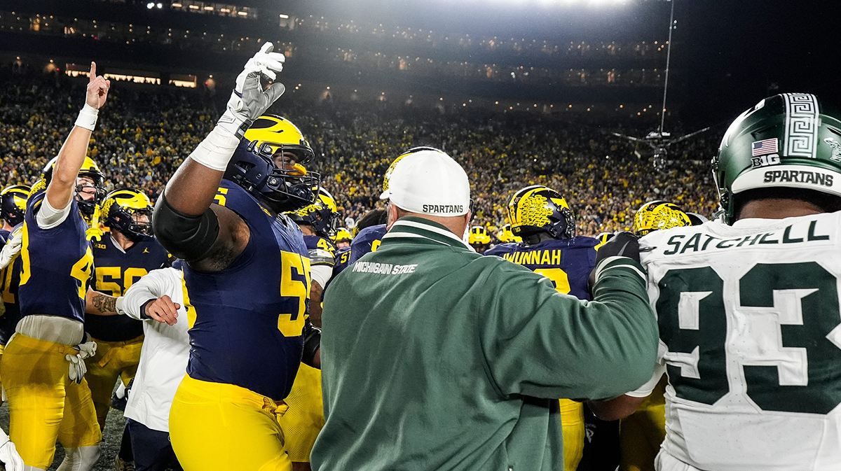 Michigan and Michigan State players get into a fight on the field as time expires at Michigan Stadium