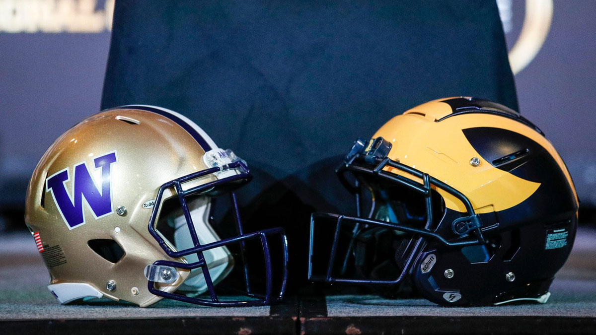 Michigan and Washington football helmets during a CFP national championship head coaches news conference at Liberty Hall