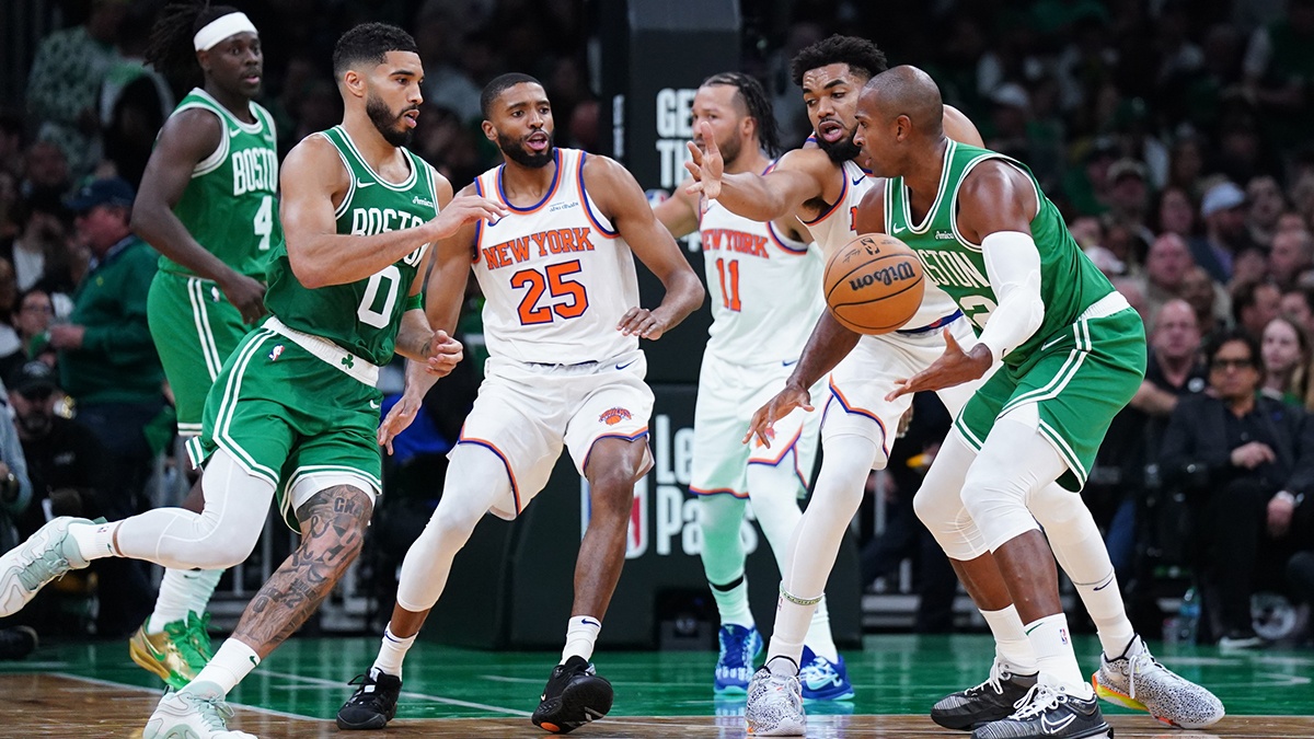 Boston Celtics center Al Horford (42) hands off the ball to forward Jayson Tatum (0) against the New York Knicks in the second half at TD Garden