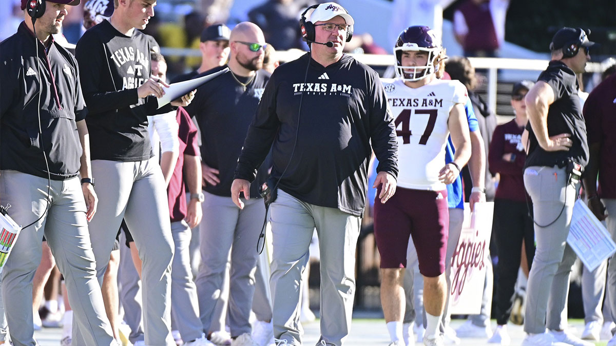 Texas A&M Aggies head coach Mike Elko walks down the sideline during the first half against the Mississippi State Bulldogs at Davis Wade Stadium at Scott Field.