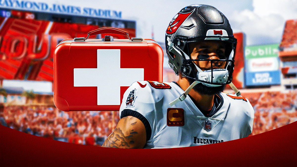 Mike Evans in a Tampa Bay Buccaneers uniform with a red and white first aid symbol as Evans injury is one of the buccaneers injuries heading into Week 7's Ravens matchup.