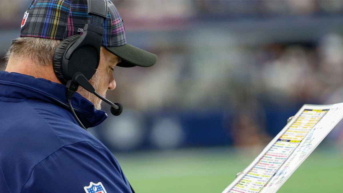 Dallas Cowboys Head Coach Mike McCarthy looks over his play chart during the first quarter against the Detroit Lions at AT&T Stadium.