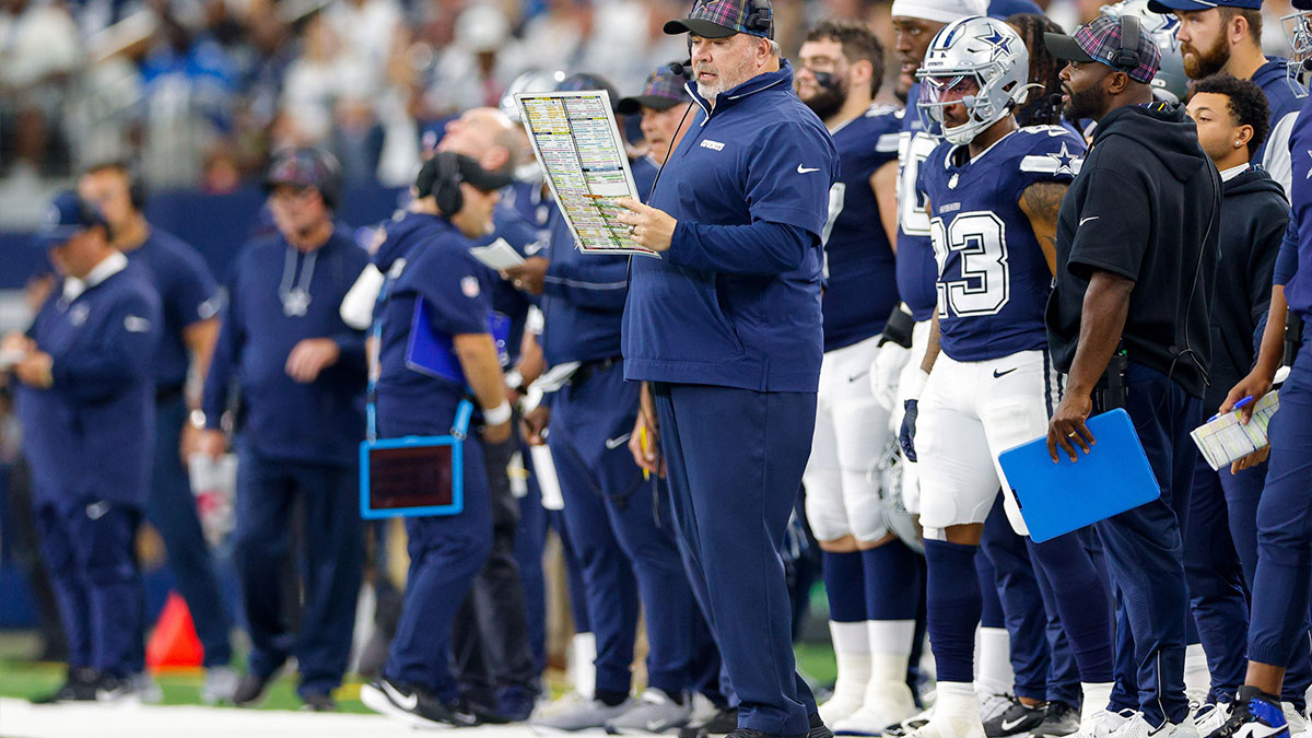 Dallas Cowboys Head Coach Mike McCarthy looks over the play chart during the first quarter against the Detroit Lions at AT&T Stadium. 