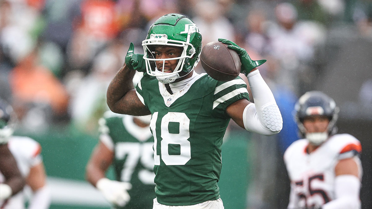 Sep 29, 2024; East Rutherford, New Jersey, USA; New York Jets wide receiver Mike Williams (18) celebrates a first down reception during the second half against the Denver Broncos at MetLife Stadium.