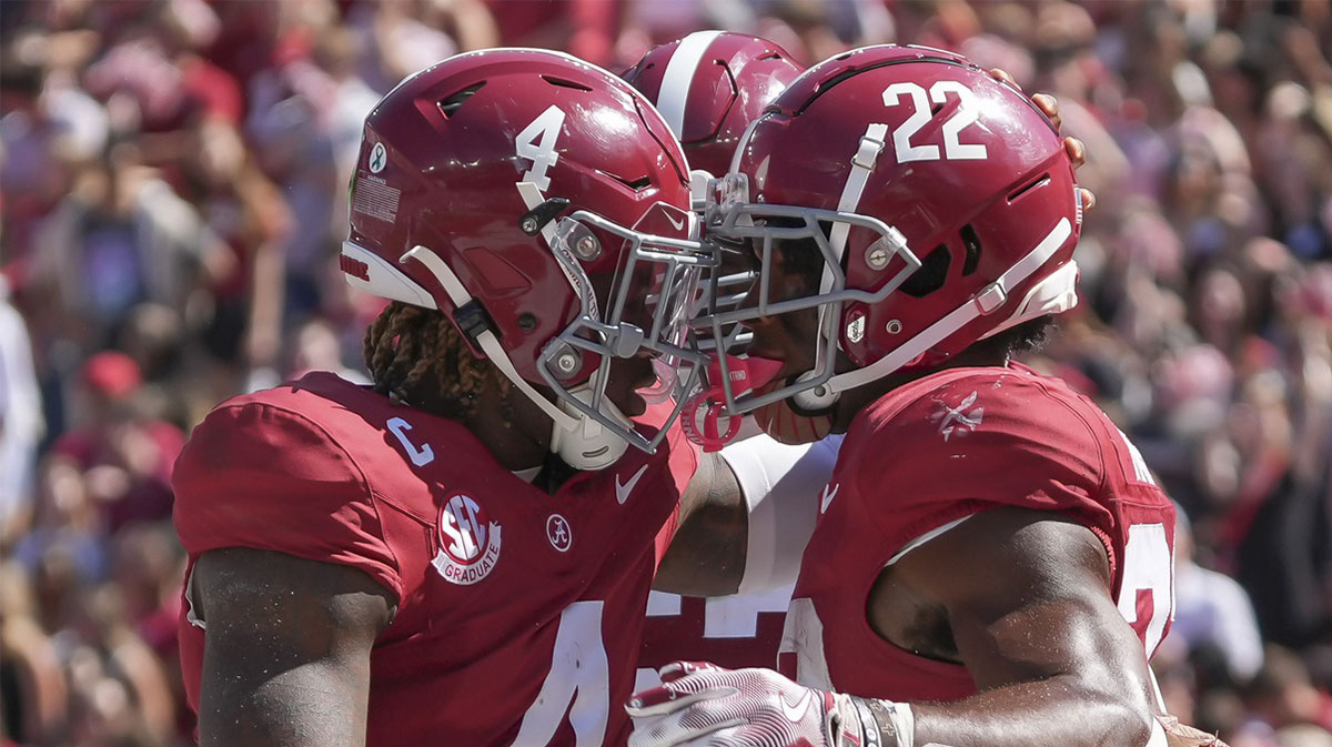 Oct 12, 2024; Tuscaloosa, Alabama, USA; Alabama Crimson Tide quarterback Jalen Milroe (4) and Alabama Crimson Tide running back Justice Haynes (22) celebrate after Haynes scored at touchdown against South Carolina at Bryant-Denny Stadium. Mandatory Credit: Gary Cosby Jr.-Imagn Images