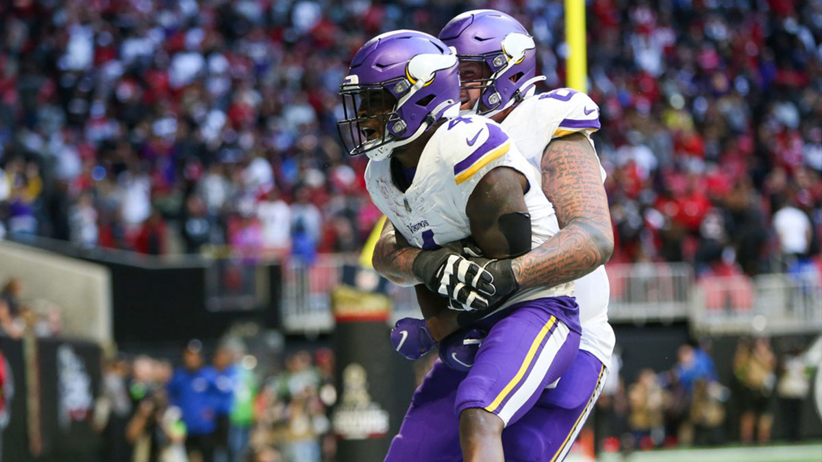 Minnesota Vikings wide receiver Brandon Powell (4) celebrates after a touchdown with guard Dalton Risner (66) against the Atlanta Falcons in the second half at Mercedes-Benz Stadium.