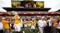 Missouri Tigers head coach Eliah Drinkwitz leads his team onto the field prior to a game against the Vanderbilt Commodores at Faurot Field at Memorial Stadium.