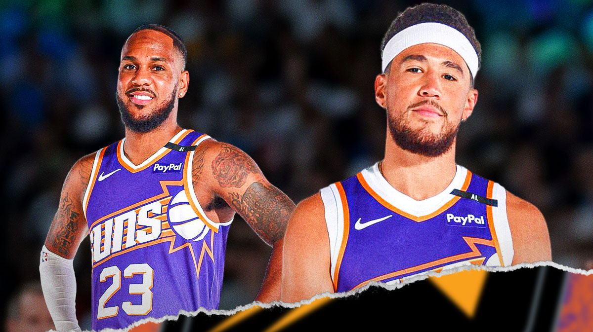 Phoenix Suns guards' Devin Booker and Monte Morris standing next to each other with a background of the Suns fanbase behind them