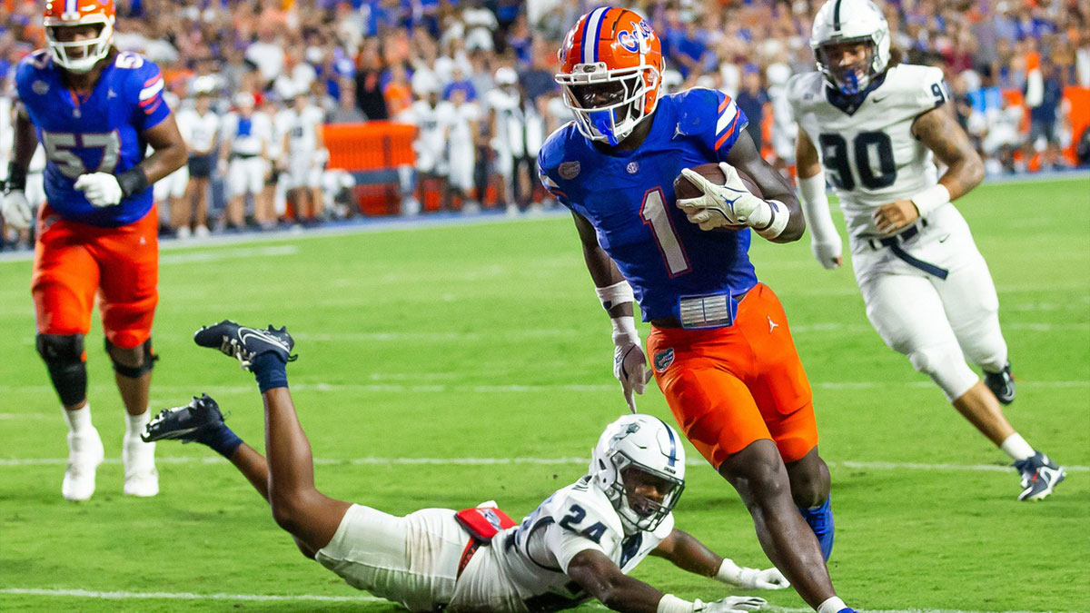 Samford Bulldogs safety Edwin Dearman (24) tries to chase down Florida Gators running back Montrell Johnson Jr. (1) as he scores a touch down during the first half at Ben Hill Griffin Stadium in Gainesville, FL on Saturday, September 7, 2024 against the Samford Bulldogs. The Gators lead 14-0 at the half.