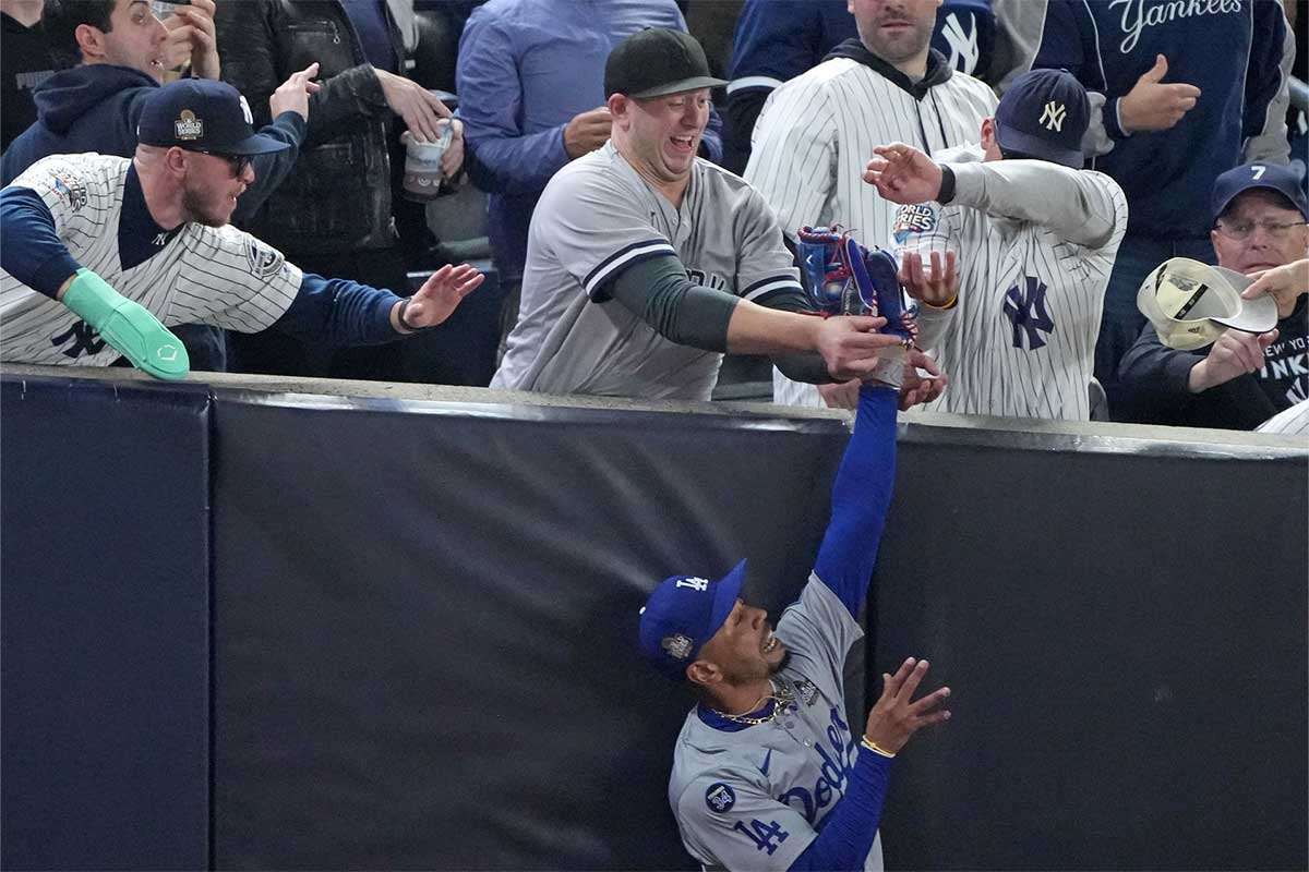 Los Angeles Dodgers outfielder Mookie Betts (50) makes a catch in foul terriotory against the New York Yankees in the first inning during game four of the 2024 MLB World Series at Yankee Stadium.