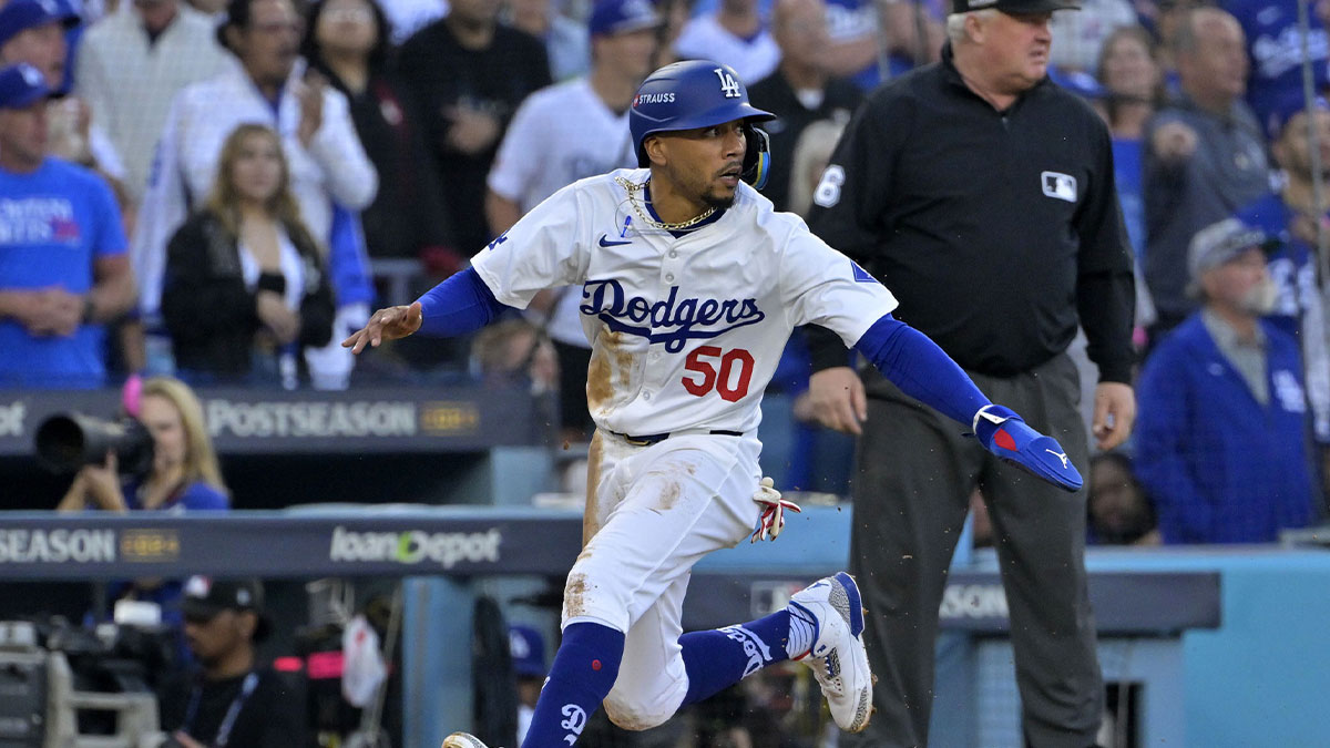 Los Angeles Dodgers shortstop Mookie Betts (50) runs towards home plate against the New York Mets during the first inning in game one of the NLCS for the 2024 MLB Playoffs at Dodger Stadium.