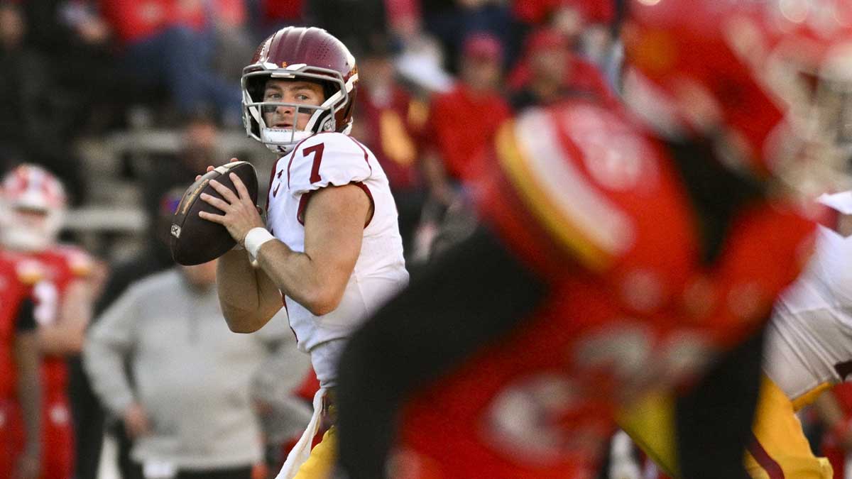 Southern California Trojans quarterback Miller Moss (7) looks down field as Maryland Terrapins linebacker Keyshawn Flowers (23) drops back in coverage during the second half at SECU Stadium.