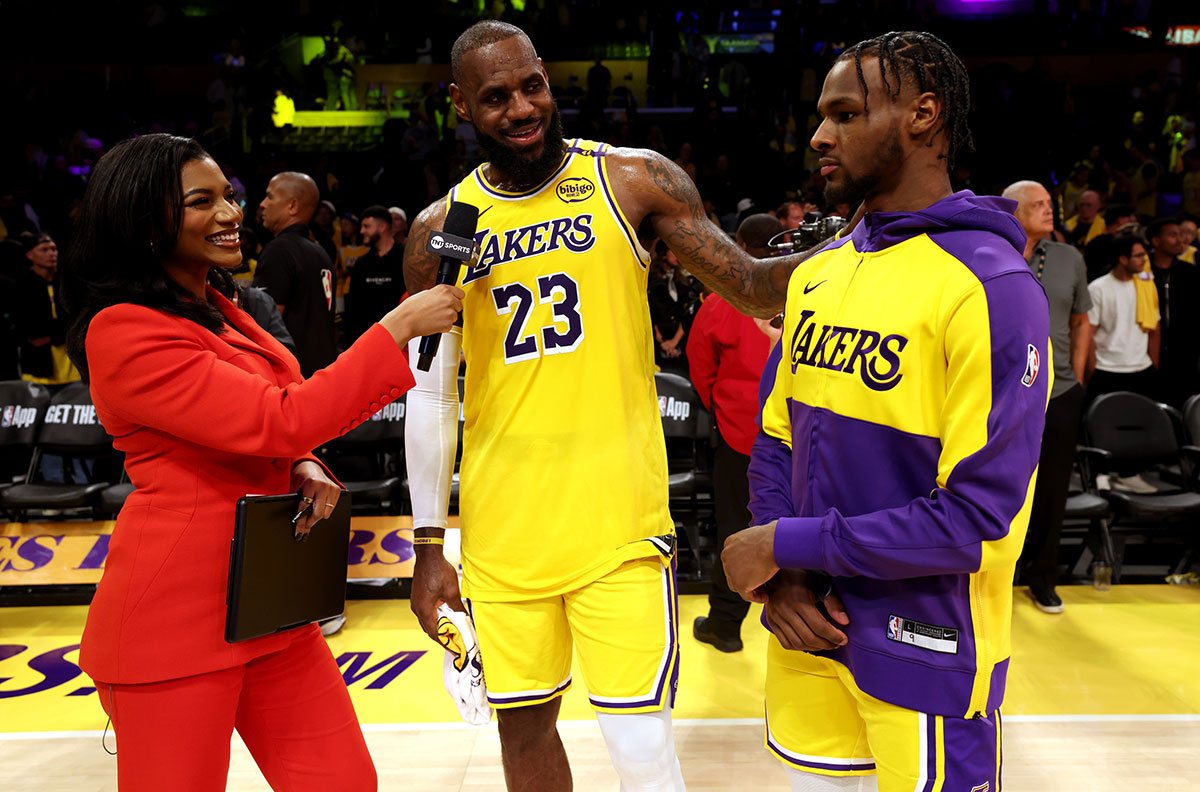 Oct 22, 2024; Los Angeles, California, USA; NBA on TNT sideline reporter Taylor Rooks interviews Los Angeles Lakers forward LeBron James (23) and guard Bronny James (9) after they defeated the Minnesota Timberwolves at Crypto.com Arena.