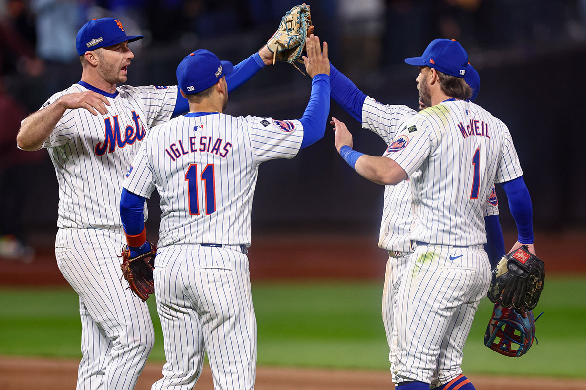 New York Mets first baseman Pete Alonso (20) and second baseman Jose Iglesias (11) and second baseman Jeff McNeil (1) and right fielder Tyrone Taylor (15) celebrates after the Mets defatted the Los Angeles Dodgers in game five of the NLCS for the 2024 MLB playoffs at Citi Field.