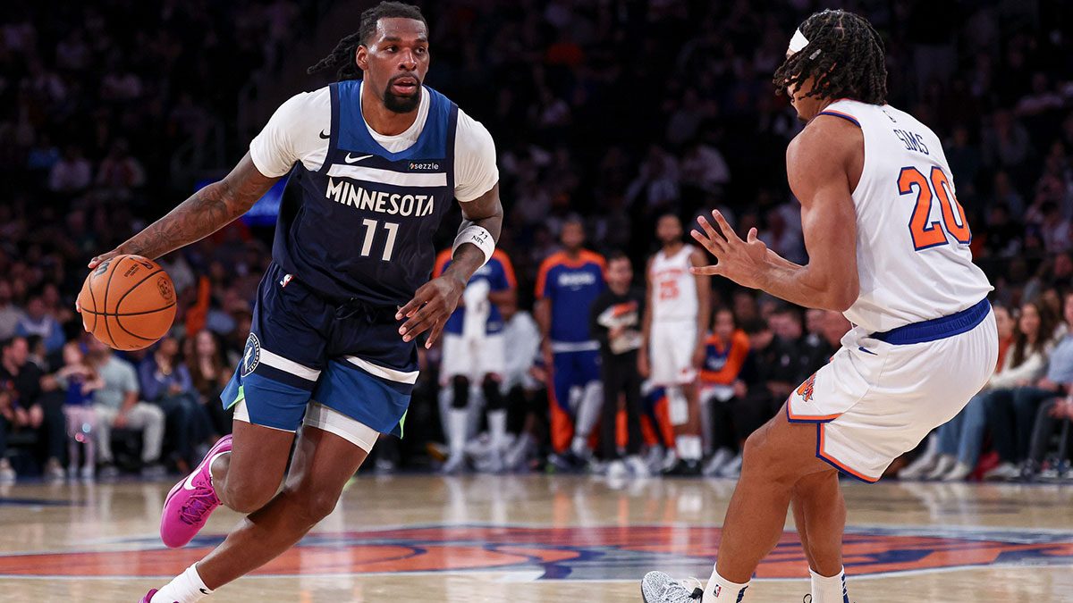 Minnesota Timberwolves center Naz Reid (11) dribbles as New York Knicks center Jericho Sims (20) defends during the second half at Madison Square Garden.