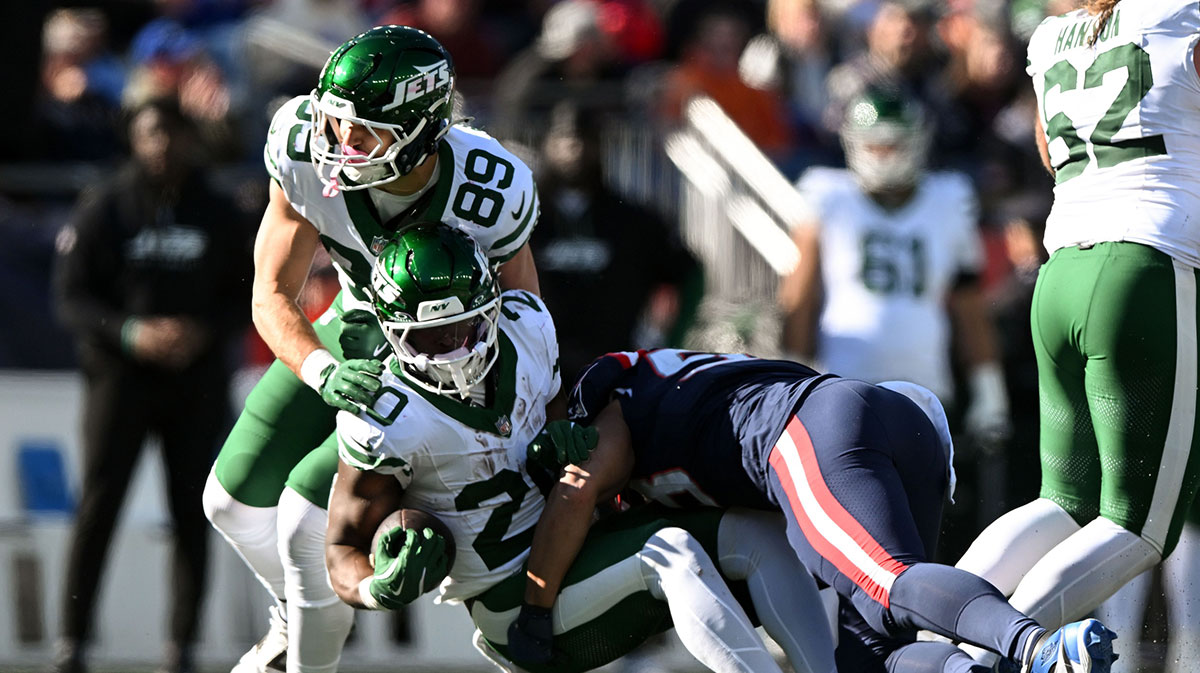 New England Patriots linebacker Christian Elliss (53) tackles New York Jets running back Breece Hall (20) during the first half at Gillette Stadium.