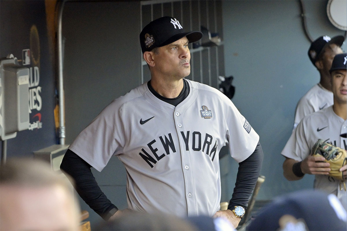 New York Yankees manager Aaron Boone (17) ooks on from the dugout before game one against the Los Angeles Dodgers in the 2024 MLB World Series at Dodger Stadium.