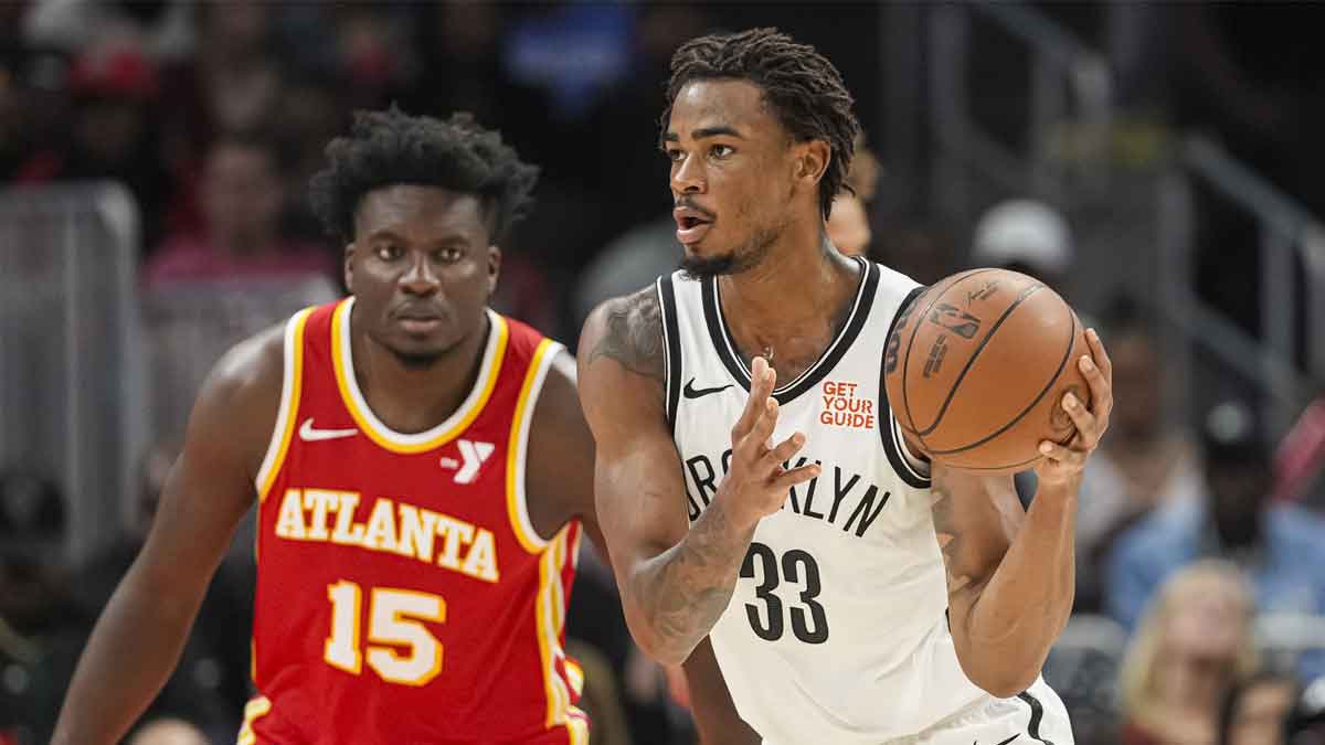 Brooklyn Nets center Nic Claxton (33) handles the ball against the Atlanta Hawks during the second half at State Farm Arena.