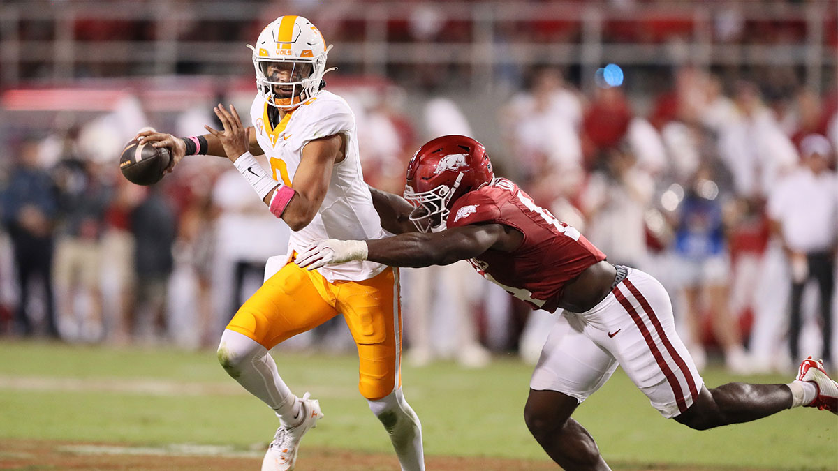 Oct 5, 2024; Fayetteville, Arkansas, USA; Tennessee Volunteers quarterback Nico Iamaleava (8) scrambles out of the pocket in the second quarter against the Arkansas Razorbacks at Donald W. Reynolds Razorback Stadium. Mandatory Credit: Nelson Chenault-Imagn Images