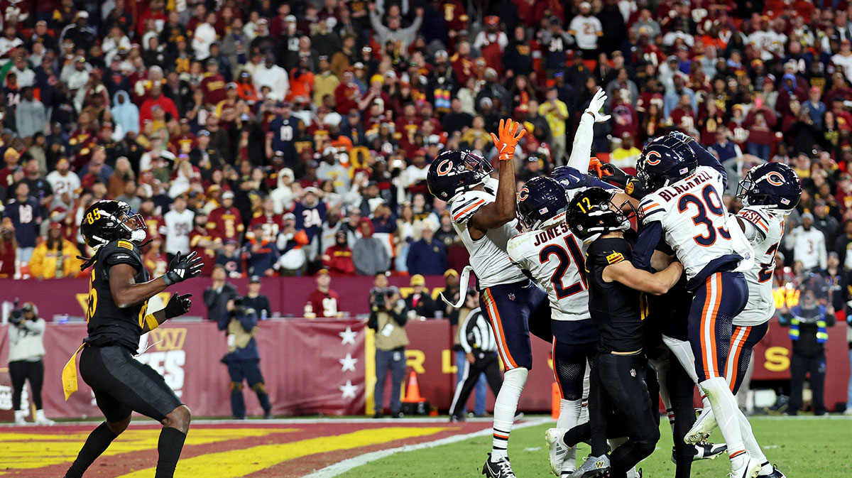 Washington Commanders wide receiver Noah Brown (85) catches a Hail Mary pass that was tipped with no time left to beat the Chicago Bears at Commanders Field.