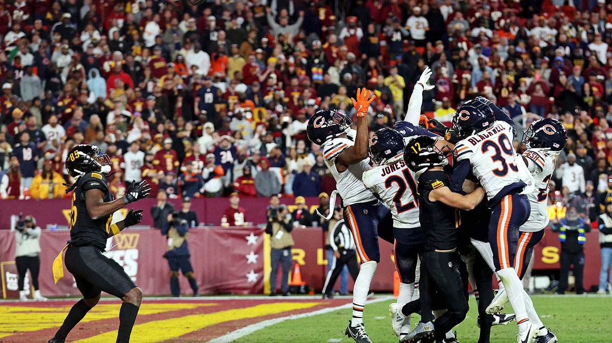 Washington Commanders wide receiver Noah Brown (85) catches a Hail Mary pass that was tipped with no time left to beat the Chicago Bears at Commanders Field.