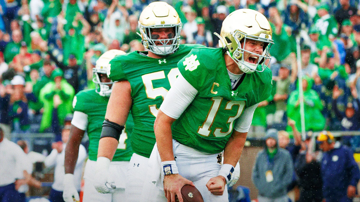 Notre Dame quarterback Riley Leonard (13) celebrates scoring a touchdown during a NCAA college football game between Notre Dame and Louisville at Notre Dame Stadium on Saturday, Sept. 28, 2024, in South Bend.