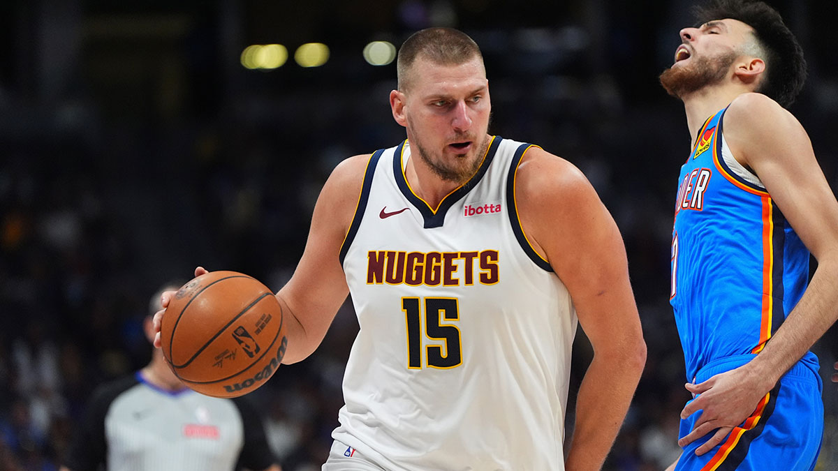 Denver Nuggets center Nikola Jokic (15) drives at Oklahoma City Thunder forward Chet Holmgren (7) in the fourth quarter at Ball Arena