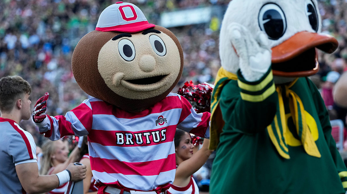 Oct 12, 2024; Eugene, Oregon, USA; Ohio State Buckeyes mascot Brutus and the Oregon Duck interact during the first half of the NCAA football game at Autzen Stadium