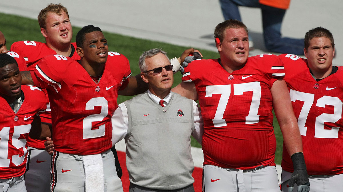 Ohio State football coach Jim Tressel, Ohio State quarterback Terrelle Pryor (2), Ohio State offensive linesman Connor Smith (77) and Ohio State offensive linesman Scott Sika (72) sing Carmen Ohio after beating Ohio University during the second half of their NCAA football game at Ohio Stadium on September 18, 2010