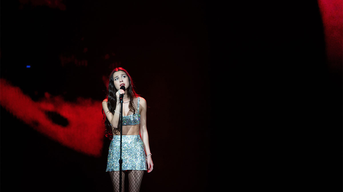 Olivia Rodrigo singing on the Guts Tour on March 9, 2024.