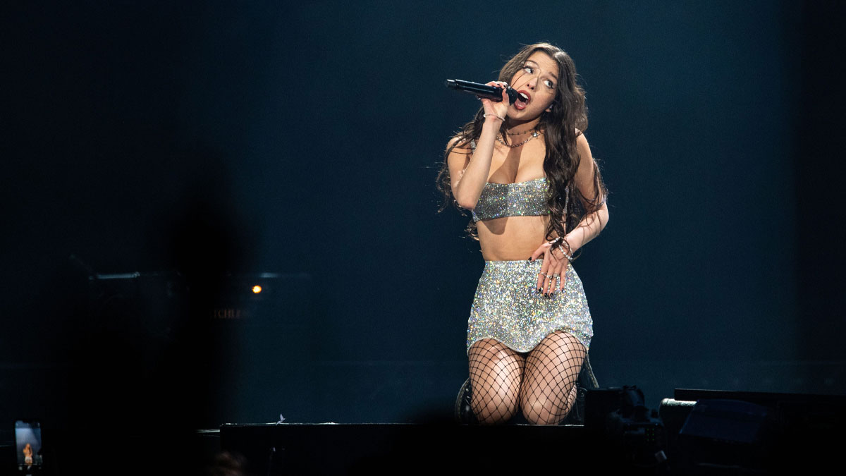 Olivia Rodrigo singing on the Guts World Tour on March 9, 2024.