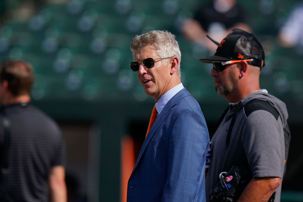 Baltimore Orioles general manager Mike Elias reacts on the field before the game between the Baltimore Orioles and the Tampa Bay Rays at Oriole Park at Camden Yards.